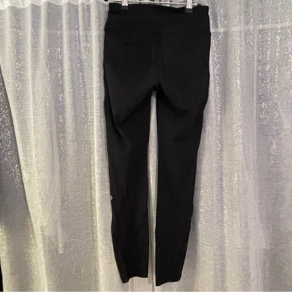 Lululemon black mesh leggings size 4 with mesh design on leg
